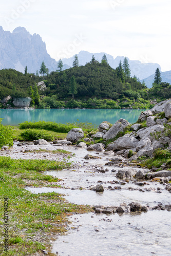 Detail shot of the wonderfull Sorapiss lake in the italian Alps, in the Dolomites mountains range close to Cortina in Veneto region, a unique place. The water of the lake is so blue it seems unreal photo