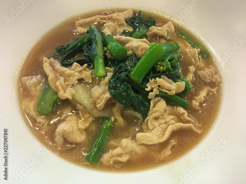 Fried noodle with pork and broccoli.