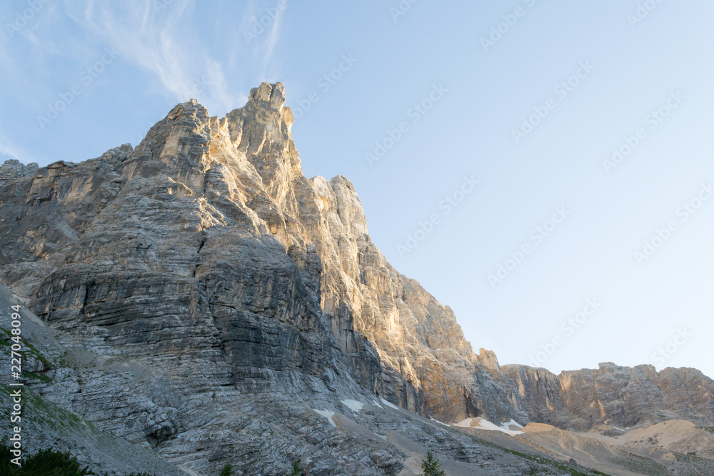 At sunset time the majestic Sorapiss peak in the italian Alps range, in particoular in the Dolomites. It is one of the highest in this group of mountains around 3000mt on the sea level