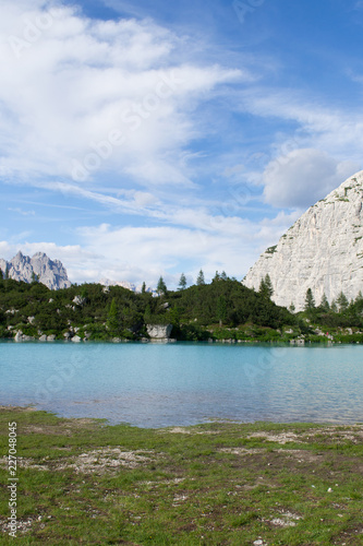 Detail shot of the wonderfull Sorapiss lake in the italian Alps, in the Dolomites mountains range close to Cortina in Veneto region, a unique place. The water of the lake is so blue it seems unreal photo