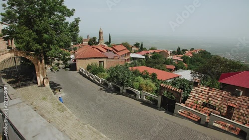 Signagi, Georgia view of ancient part city, Alazan valley vineyards, tower, defensive fortress houses red tiled roofs photo