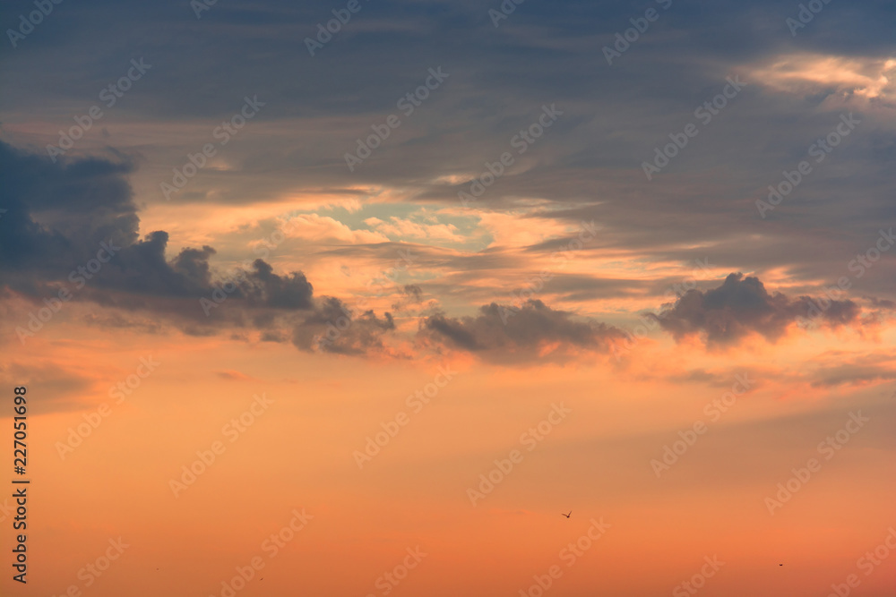 Colorful clouds on dramatic sunset sky
