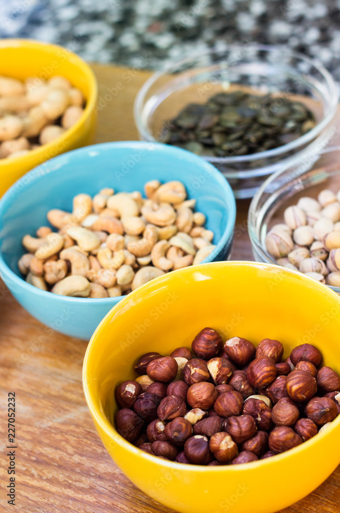 Assortment of mixed nuts on wood table background Assortment of mixed nuts on wood table background