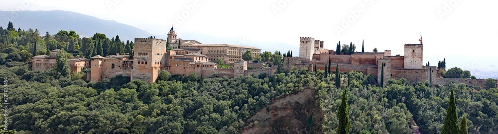 Panorama view of the historic Alhambra Palaces and Generalife Gardens in Granada, Spain.