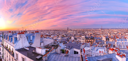 Aerial panoramic view from Montmartre over Paris roofs and Eiffel tower at nice sunrise, Paris, France © Kavalenkava