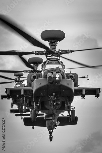 A stack of three Apache attack helicopters head-on photo
