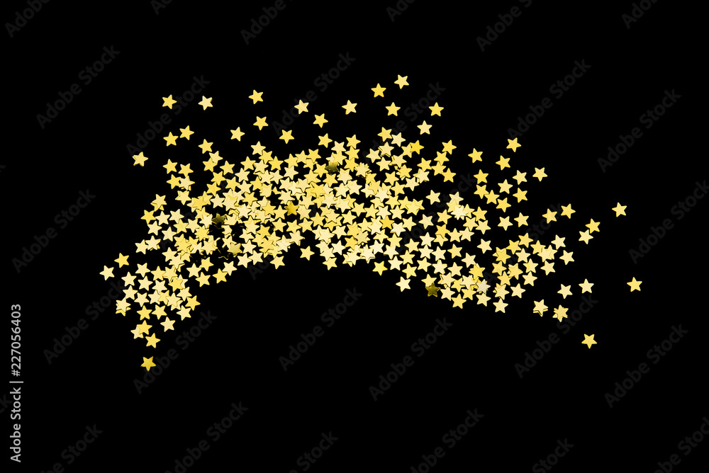 Group of gold star glitter isolated on black background  on top view