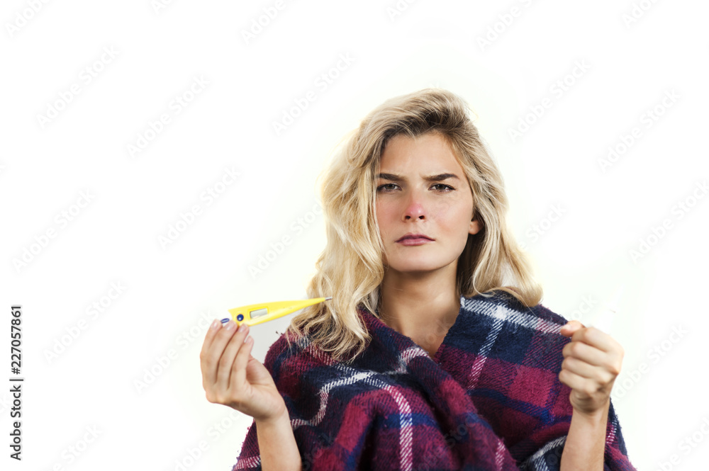 Symptoms of flu or allergies. Strong young European woman with fever, sneezing in a tissue, allergy, cold, with copy space, young girl, portrait of a sick woman, isolated on a white background. Symptoms of flu or allergies. Strong young European woman with fever, sneezing in a tissue, allergy, cold, with copy space, young girl, portrait of a sick woman, isolated on a white background.