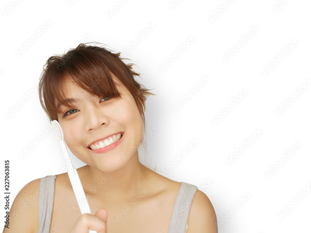 smiling happy woman with black hair brushes teeth with toothbrushon white background,copy space,Healthcare concept. smiling happy woman with black hair brushes teeth with toothbrushon white background,copy space,Healthcare concept.