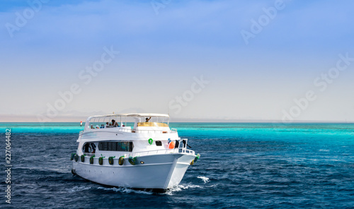 large white pleasure boat in the blue water of the Red Sea Sharm El Sheikh Egypt