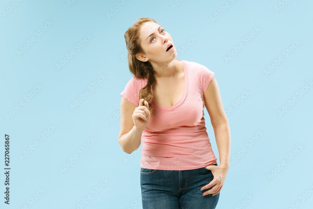 I am tired of everything. Bored woman. Boring, dull, tedious concept. Young pretty caucasian emotional woman. Human emotions, facial expression concept. Studio Isolated on trendy blue background I am tired of everything. Bored woman. Boring, dull, tedious concept. Young pretty caucasian emotional woman. Human emotions, facial expression concept. Studio Isolated on trendy blue background