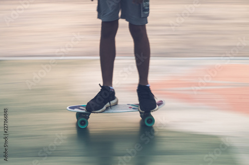 young play skate board panning is blur