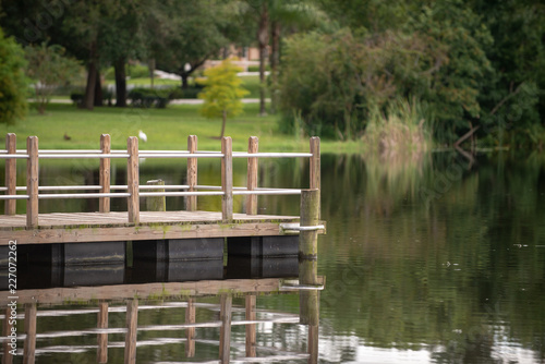 Fishing Pier over Pond Reflection