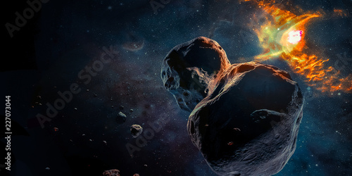 Meteorites in a deep space, science fiction fantasy in high resolution. Galaxy and flame of exploding star as a background. Ideal for wallpaper or print. Elements of this image furnished by NASA.