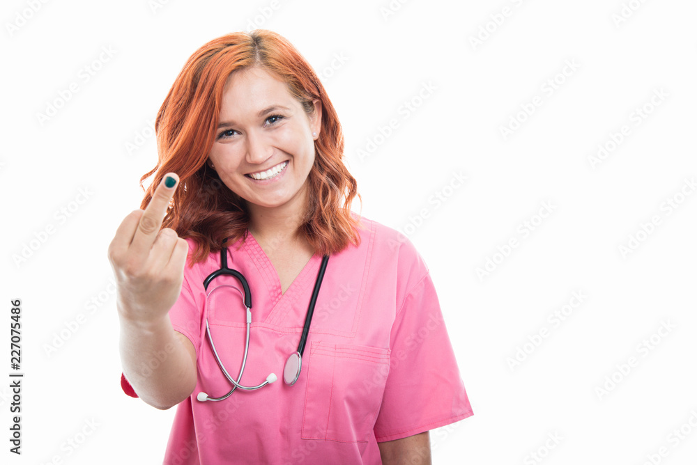 Young female doctor with stethoscope showing middle finger gesture Young female doctor with stethoscope showing middle finger gesture