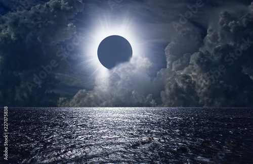 Total solar eclipse above the clouds and sea