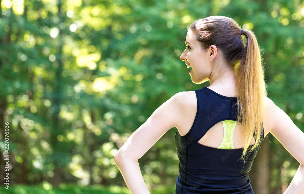 Happy healthy fit woman on a bright summer day in the forest Happy healthy fit woman on a bright summer day in the forest