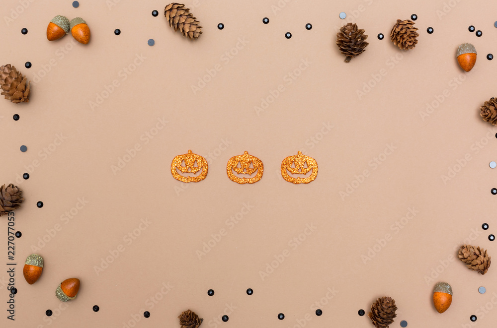 Halloween theme with decorations on a light brown paper background Halloween theme with decorations on a light brown paper background