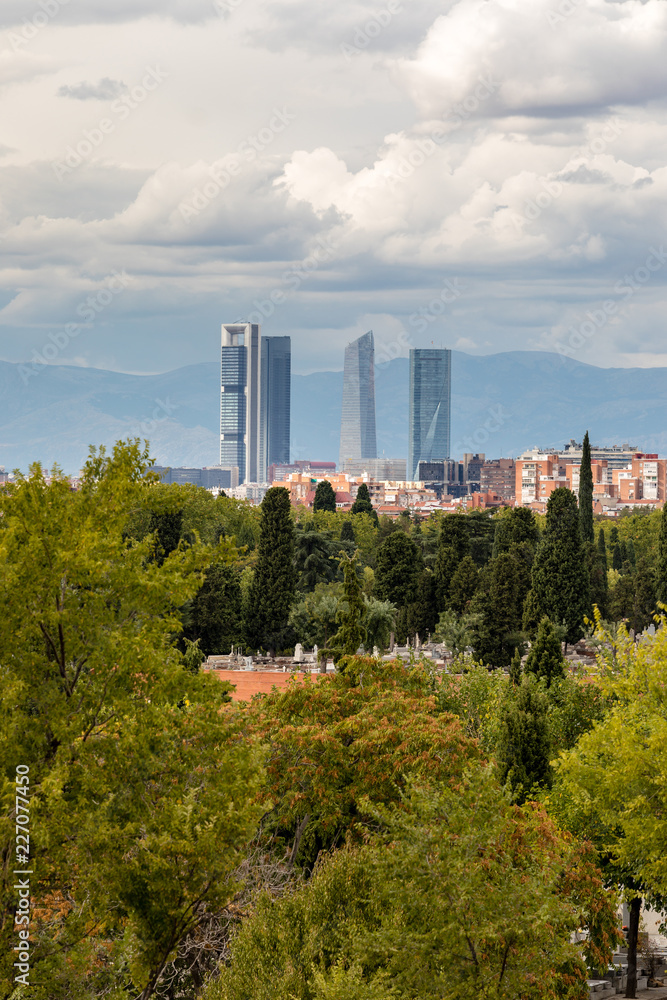 Obraz premium Skyline of Madrid with the four towers in the background and the cemetery of Almudena in the foreground