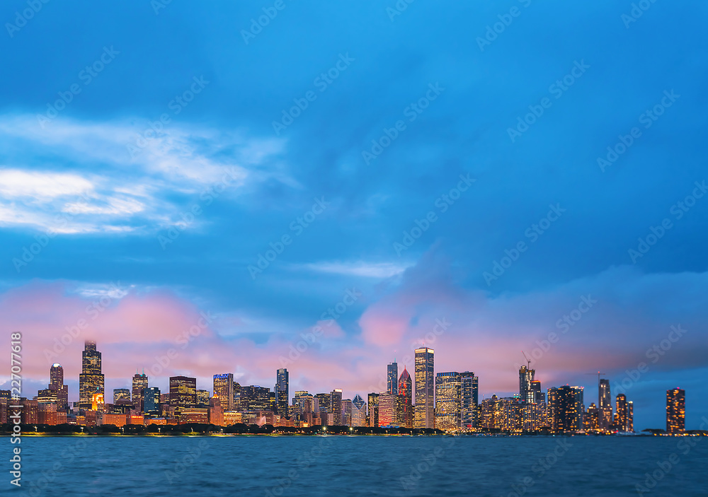 Downtown Chicago cityscape skyline at twilight with Lake Michigan in the foreground