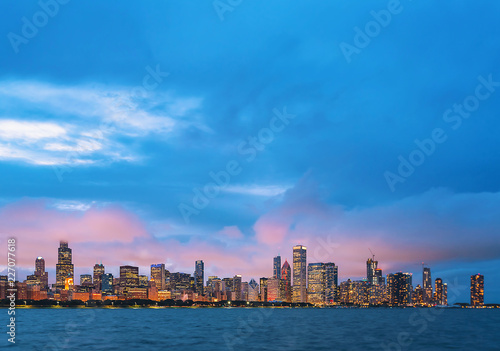 Downtown Chicago cityscape skyline at twilight with Lake Michigan in the foreground © Tierney