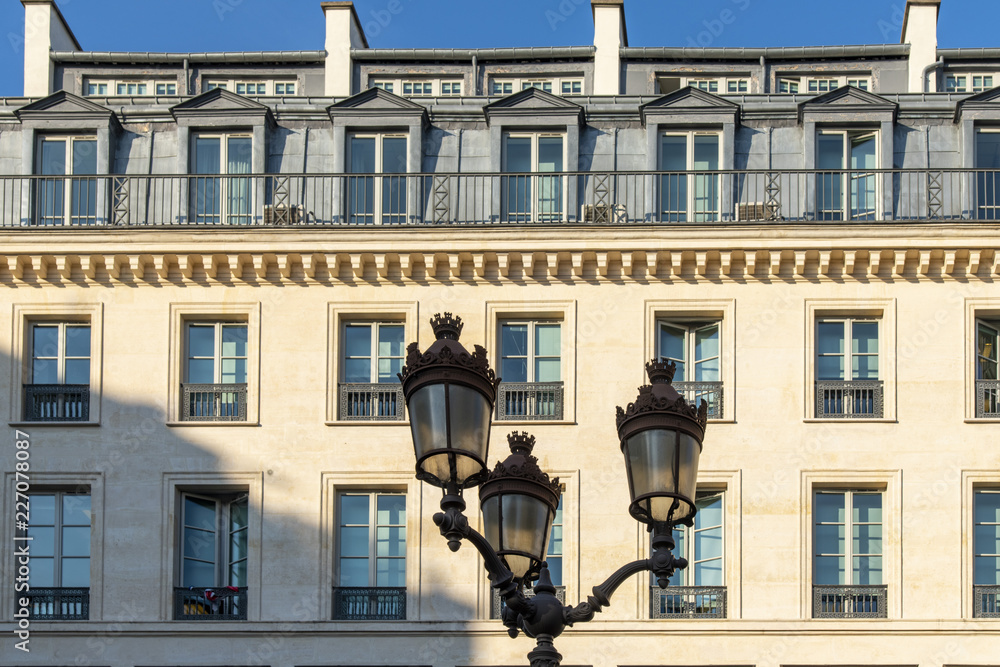 Typical beautiful building facade in the center of Paris Typical beautiful building facade in the center of Paris