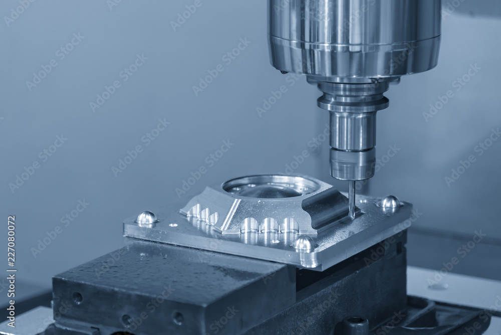 The CNC milling machine cutting the injection mold part by solid ball end mill tool.Mold manufacturing process. The CNC milling machine cutting the injection mold part by solid ball end mill tool.Mold manufacturing process.