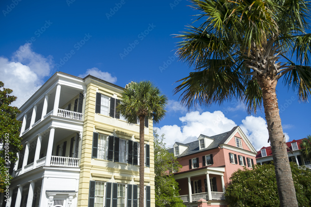 Colorful classical Southern architecture of the Battery neighborhood with palmetto palms in Charleston, South Carolina