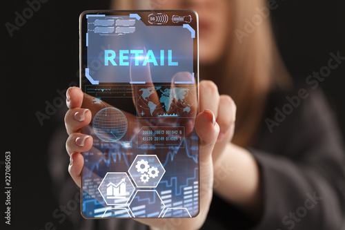 The concept of business, technology, the Internet and the network. A young entrepreneur working on a virtual screen of the future and sees the inscription: Retail