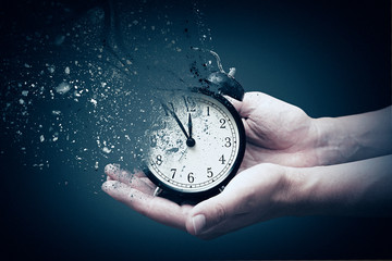 Concept of passing away, the clock breaks down into pieces