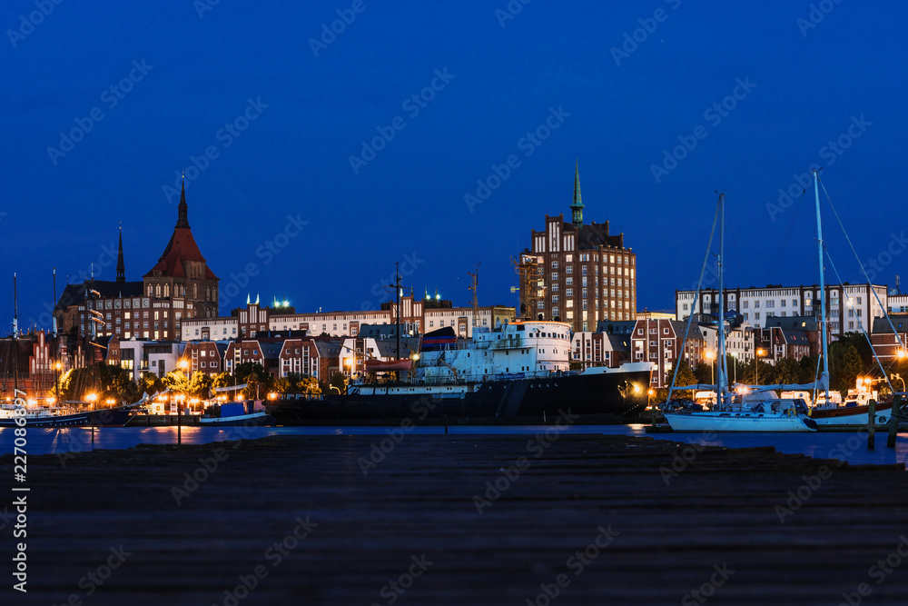 Rostock. Night Panorama view to Rostock in Germany. River Warnow and City port.