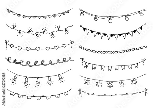 Set of hand drawn sketch garlands with flags and light bulbs. photo