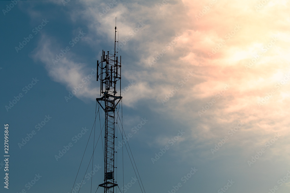 Silhouette Mobile phone transmitter pole on the sunset. Silhouette Mobile phone transmitter pole on the sunset.
