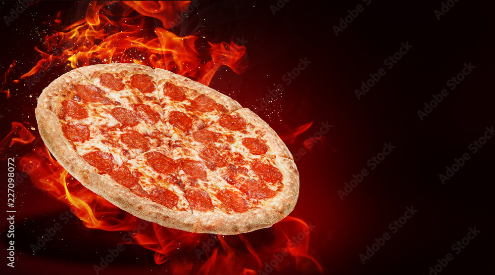 hot fresh traditional italian pizza in flames