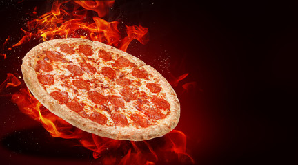 hot fresh traditional italian pizza in flames