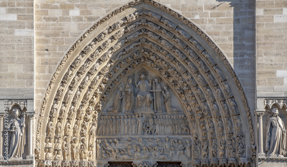 Portal over the main entrance of Notre Dame Cathedral in Paris, France
