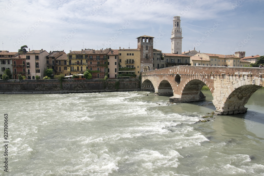 Ponte Pietra old historic brige over Adige river