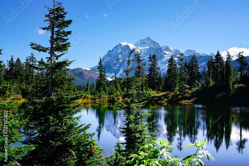 Autumn landscape of snow mountain and lake in Mt. Baker Hwy, Deming, USA