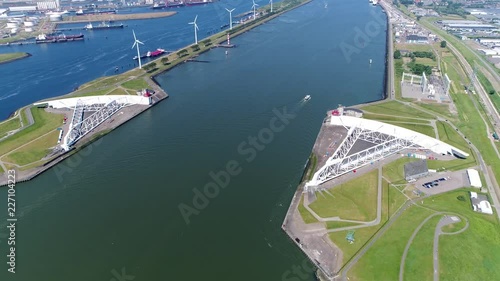 Aerial bird view footage Maeslantkering storm surge barrier on Nieuwe Waterweg Netherlands it closes if the city of Rotterdam is threatened by floods and is one of largest moving structures on earth photo
