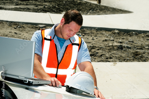 Young Male Civil Engineer With Laptop On Site