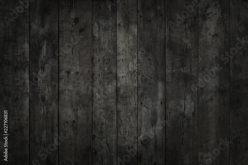 Stained, vertical boards. Black texture of wood.