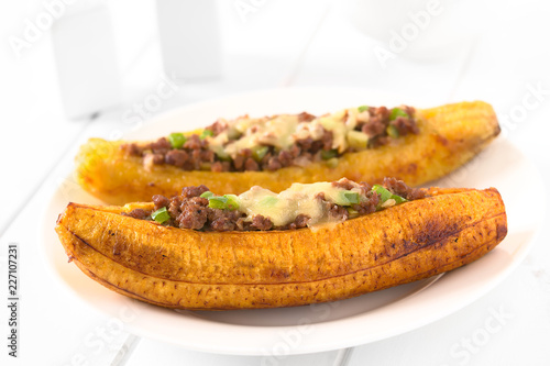 Bilde på lerret Baked ripe plantain stuffed with mincemeat, olive, green bell pepper and onion,