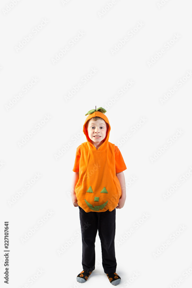 Young Boy dressed in pumpkin halloween costume