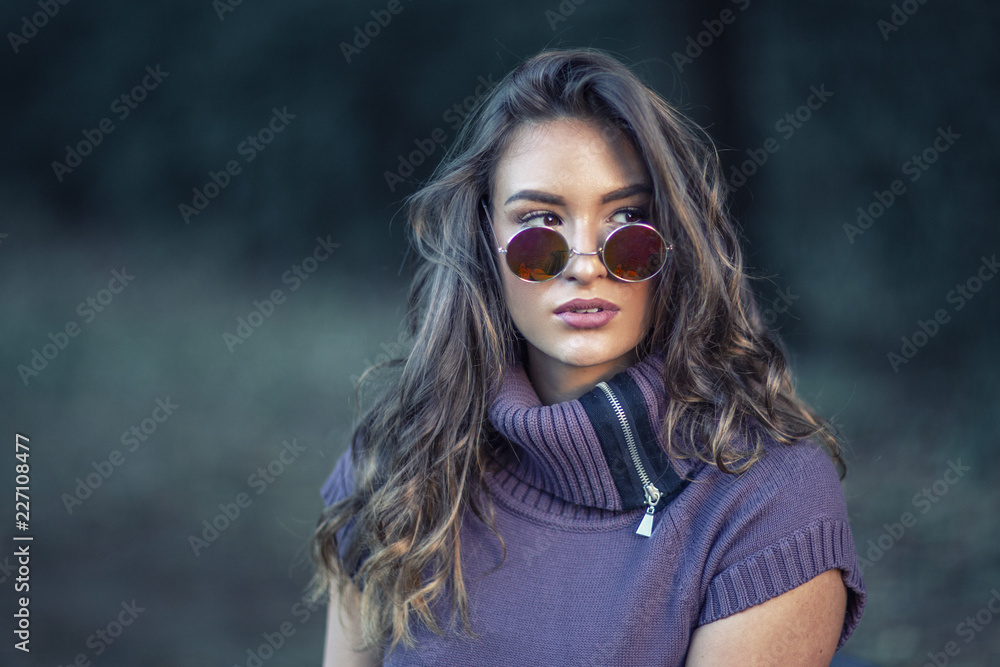 Young long hair girl in park posing Young long hair girl in park posing