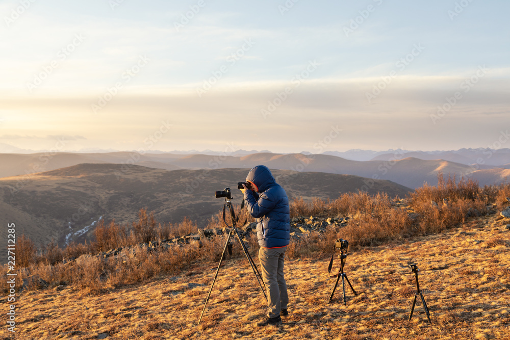 photographer talking photo on mountain