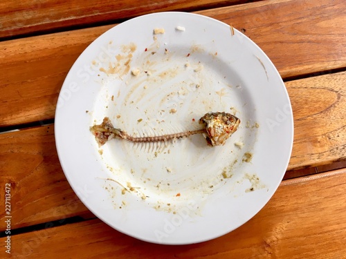 Fish bone (mackerel) on dirty dish