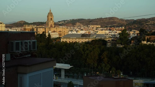 The sunrise in Malaga on church with bell tower