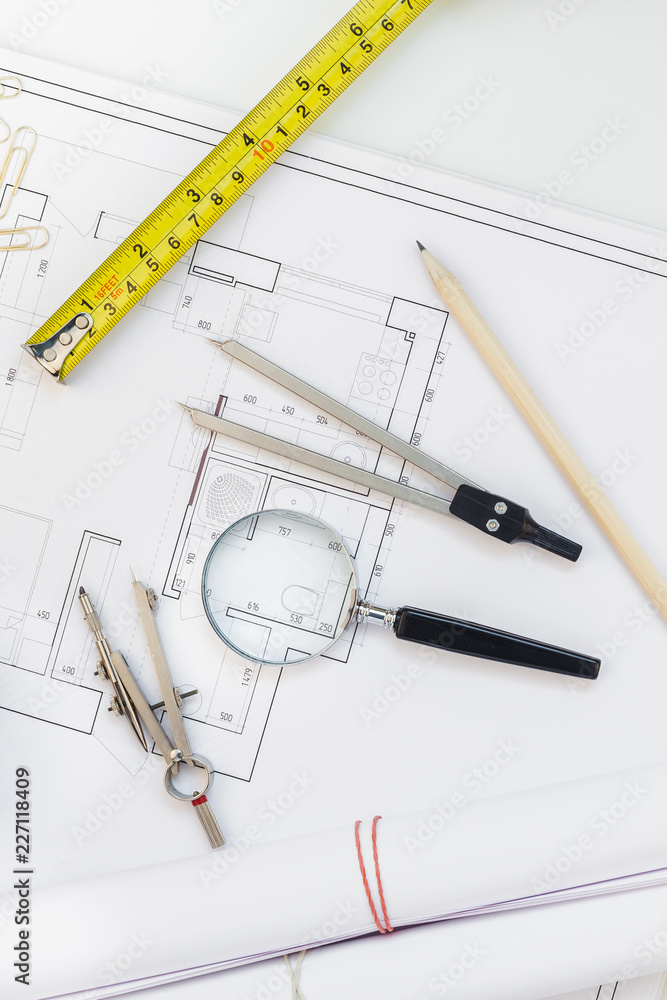 Interior designer table workplace with house plan Interior designer table workplace with house plan
