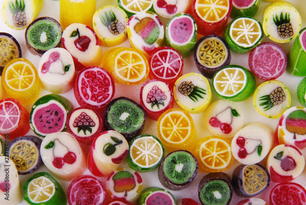 Multicolored caramel with a taste of different fruits on a white background. Multicolored caramel with a taste of different fruits on a white background.