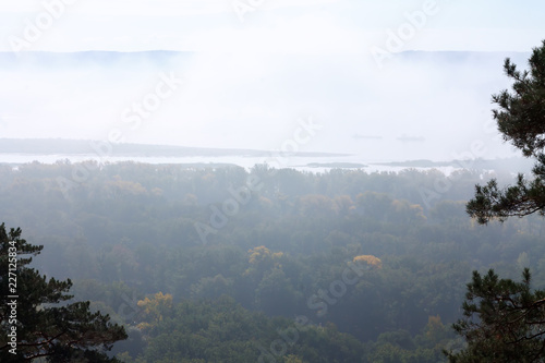 Mist over the river in the autumn morning. © elenabarfoto